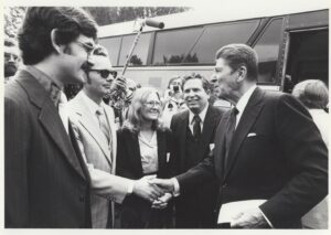 Robert Walters shakes hands with Ronald Reagan.